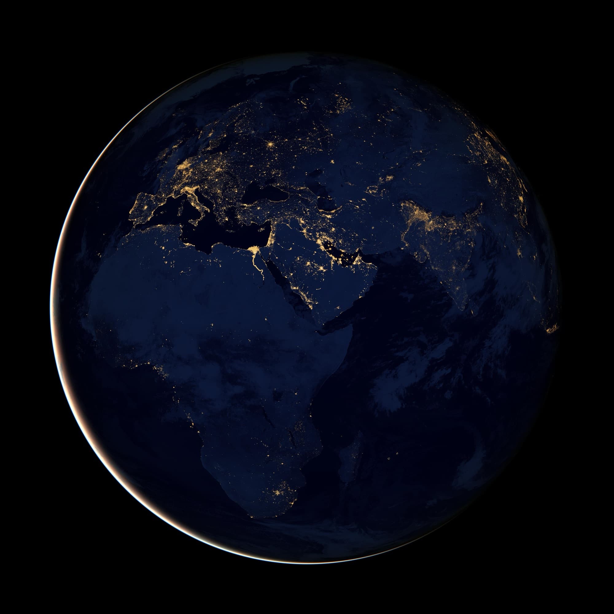 Africa at night, seen from space with city lights glowing gold